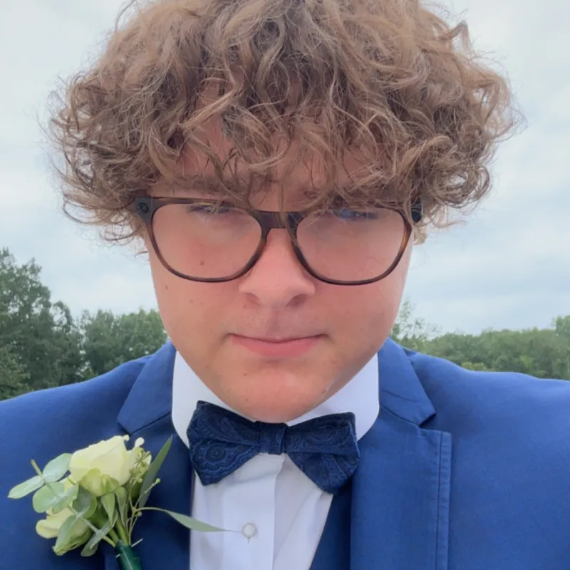 Photo of student with blue tux on