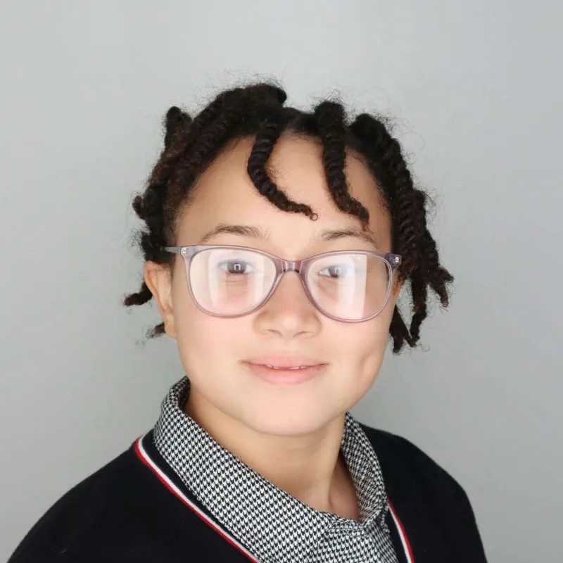 Headshot photo of student with black sweater
