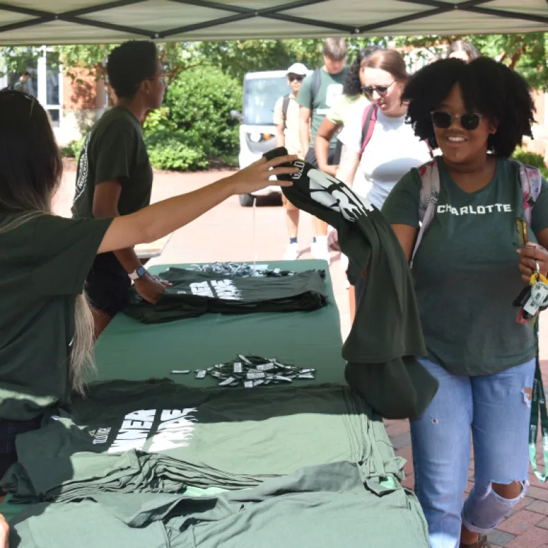 T-shirts being distributed at a resource fair